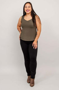 Model smiling in Ritzy tank top, relaxed pose, front angled view