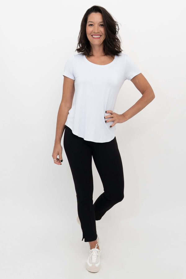 Model wearing the Nadine Crop Pant styled with a white T-shirt and white sneakers