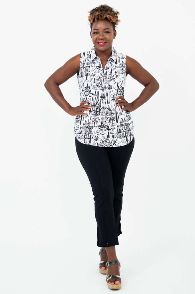 Full body view of model in Hula quarter zip tank and black pants