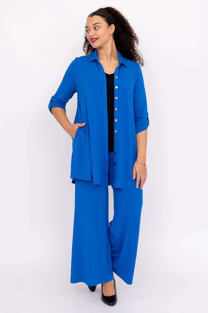 Model wearing Jondo cobalt blue wide leg pants and matching button-up shirt