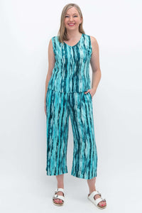 Model wearing Landon Capri Pants and matching sleeveless top in blue striped pattern