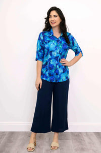 Model in Lorine blue blouse with navy wide-leg pants, facing forward