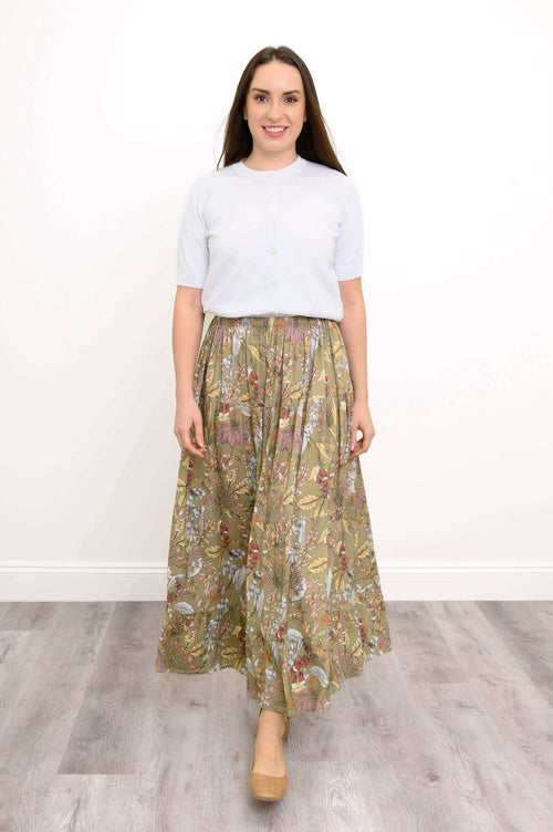 Model wearing Roma tiered floral skirt with light top, front view