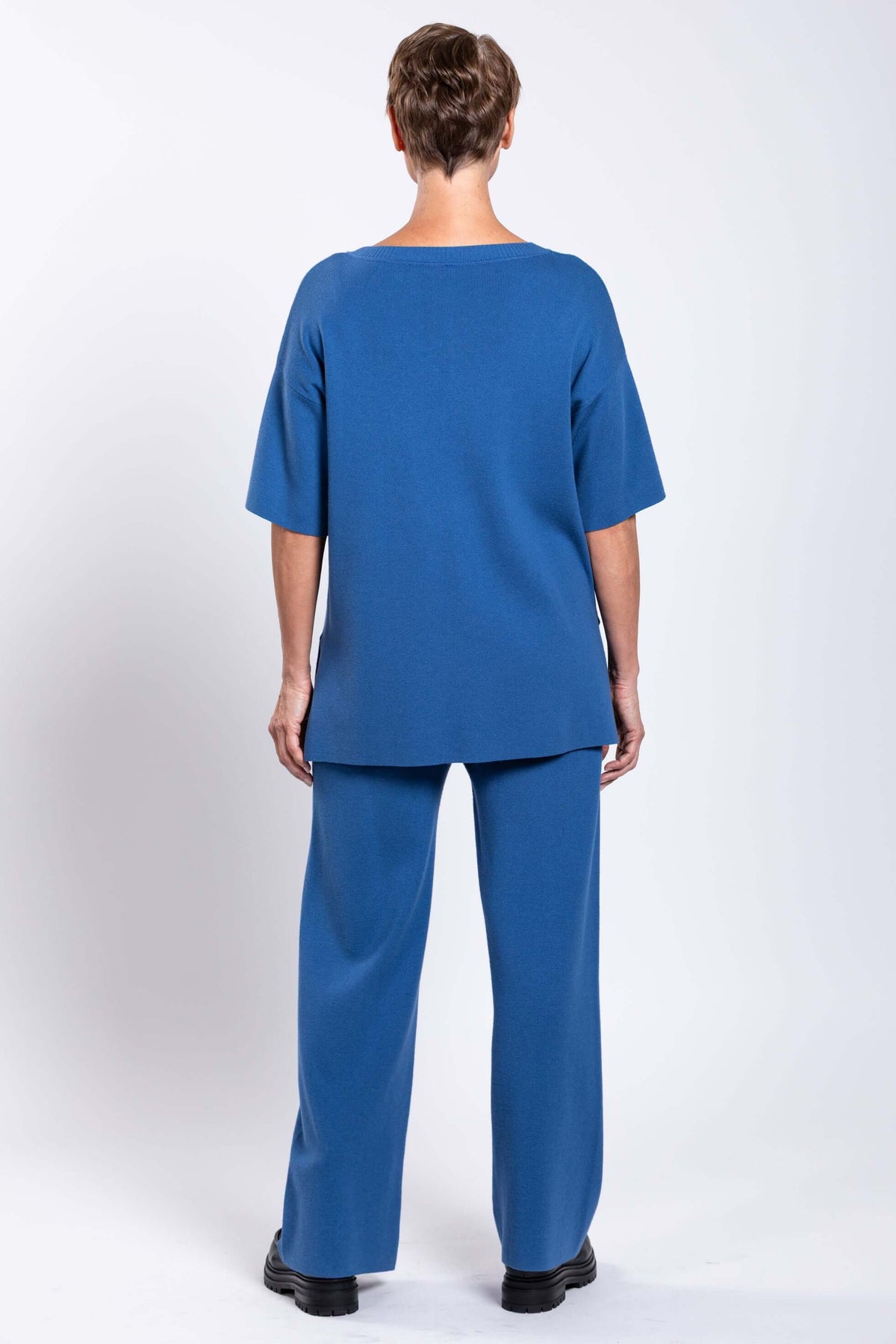 Back view of model wearing blue Bailey Pant and top
