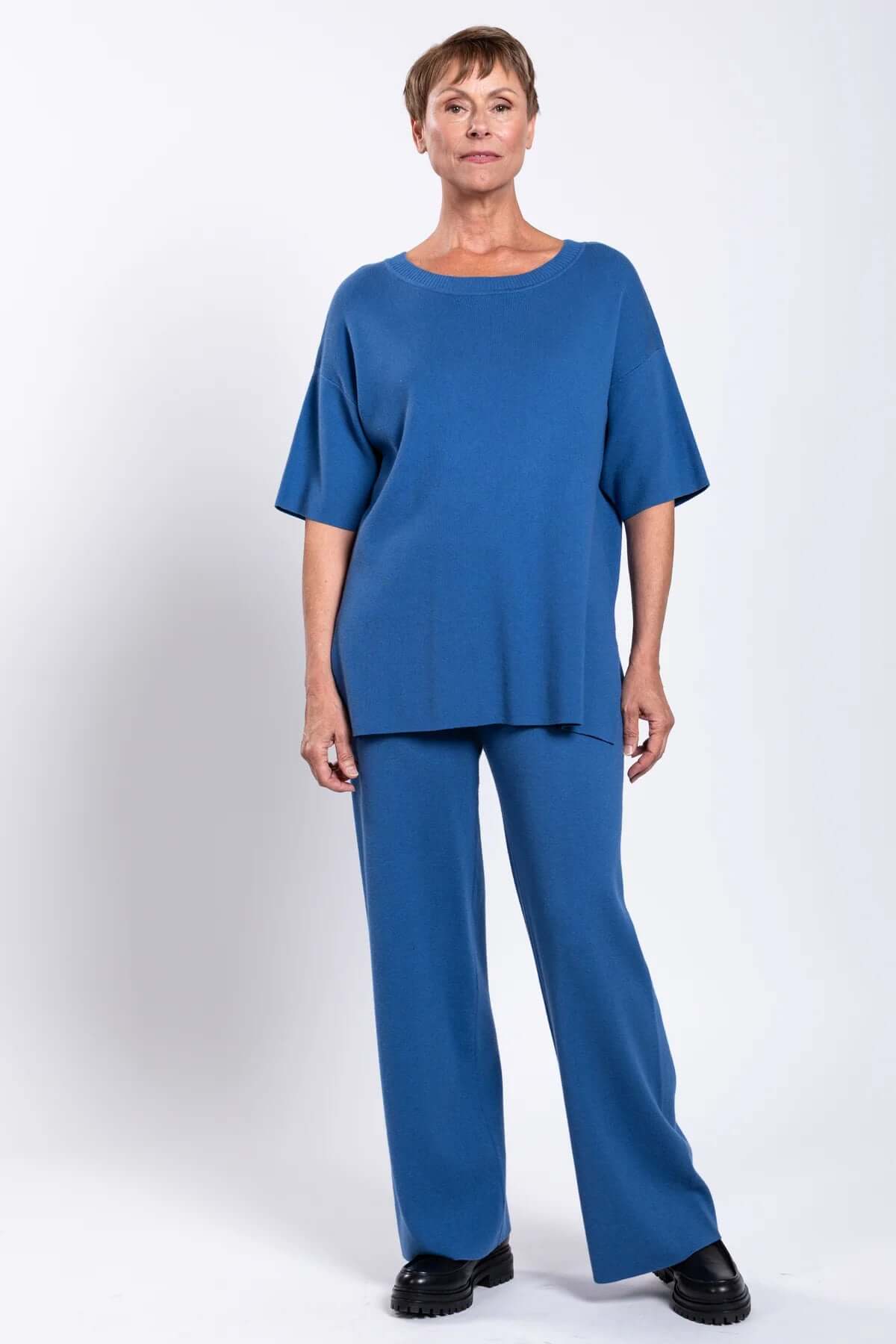 Front view of model wearing blue Bailey Pant and top
