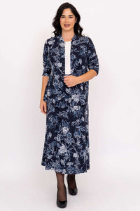 Model wearing matching navy floral skirt and jacket set