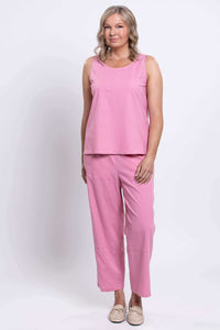 Model in pink Boardwalk Pants and sleeveless top, hands at sides, front view