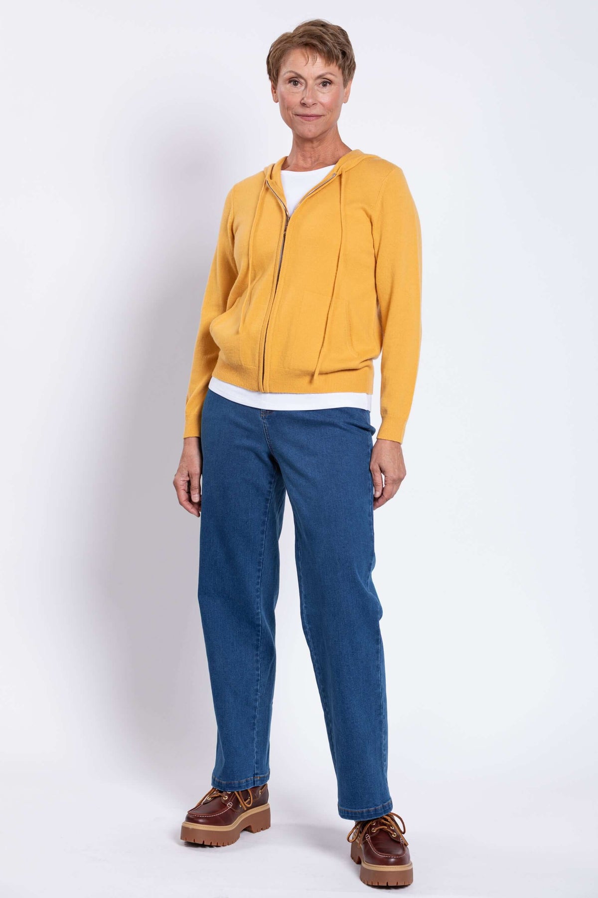 Model in yellow wool cashmere hoodie standing relaxed
