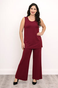 Full-length front view of a woman wearing a burgundy sleeveless knit tank top paired with matching wide-leg pants.