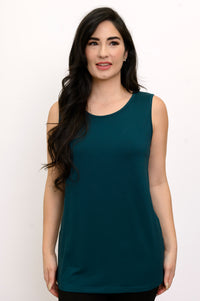 Front view of a smiling woman wearing a scoop neck crystal teal bamboo French terry tank top.