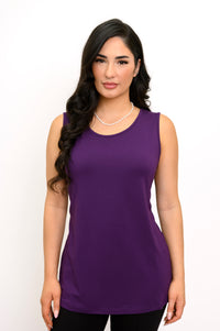 Front view of a female model wearing a French Terry purple tank and black pants against a white backdrop