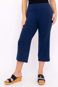 Side angle of navy blue yoga capri pants on model