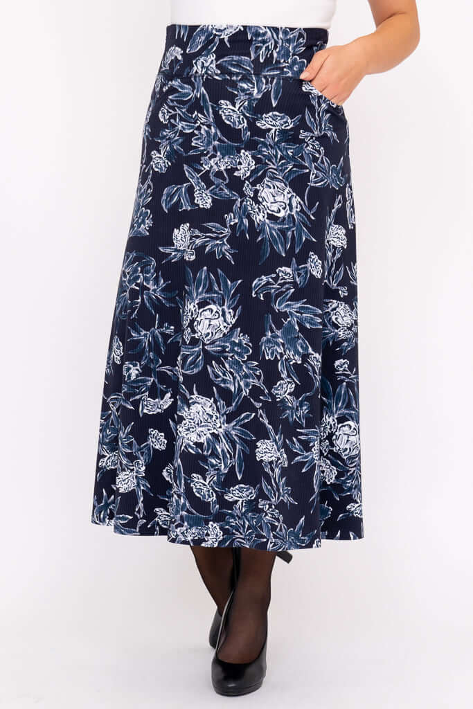 Navy floral midi skirt with pockets and A-line silhouette on model
