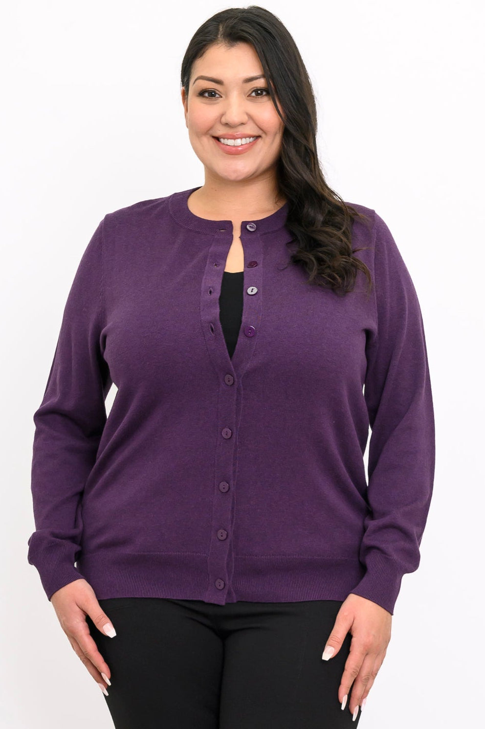 Close up front view of a woman wearing an amethyst purple crewneck button up cotton blend cardigan.