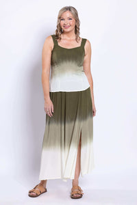 Woman posing in an olive ombre maxi skirt with multiple slits.
