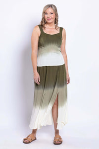 Woman in olive ombre sleeveless tank and skirt with side slit, standing and smiling