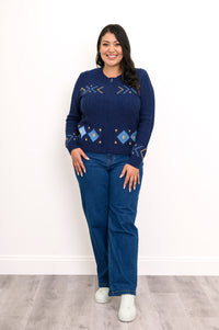 Classic horizontal geometric pattern navy top featuring ribbed cuffs and hem, styled casually with blue jeans.