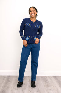 Front-facing view of a women's retro-style indigo zip-up pullover with long sleeves and set-in shoulders.