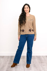 Front view of a women's cozy neutral-toned mock neck sweater, highlighting a comfortable, body-skimming drape.