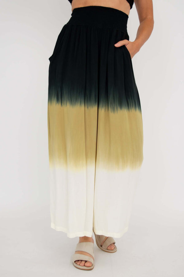 Front view of wide leg ombre pants with black, tan, and white gradient