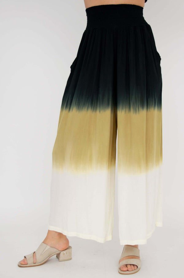 Side view of wide leg ombre pants with elastic waistband and pockets