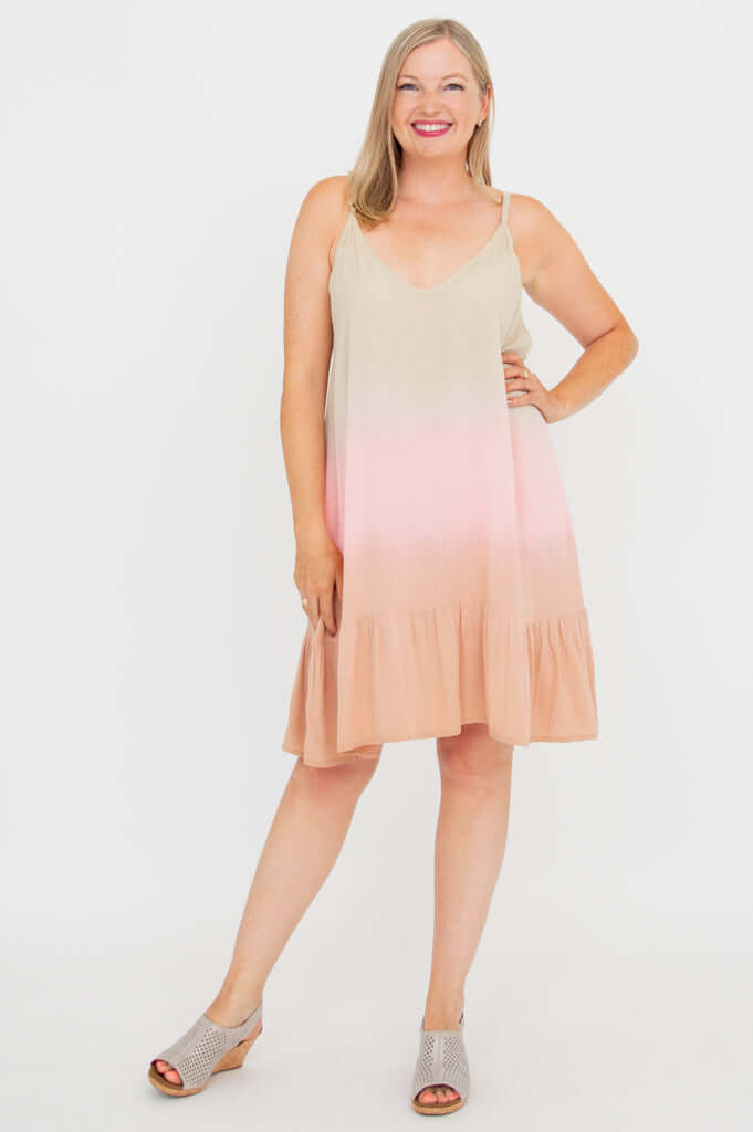 Front view of woman posing in ombre tiered dress with adjustable straps and scoop neckline