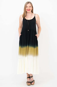Model showing pockets in a sleeveless ombre maxi dress, front view