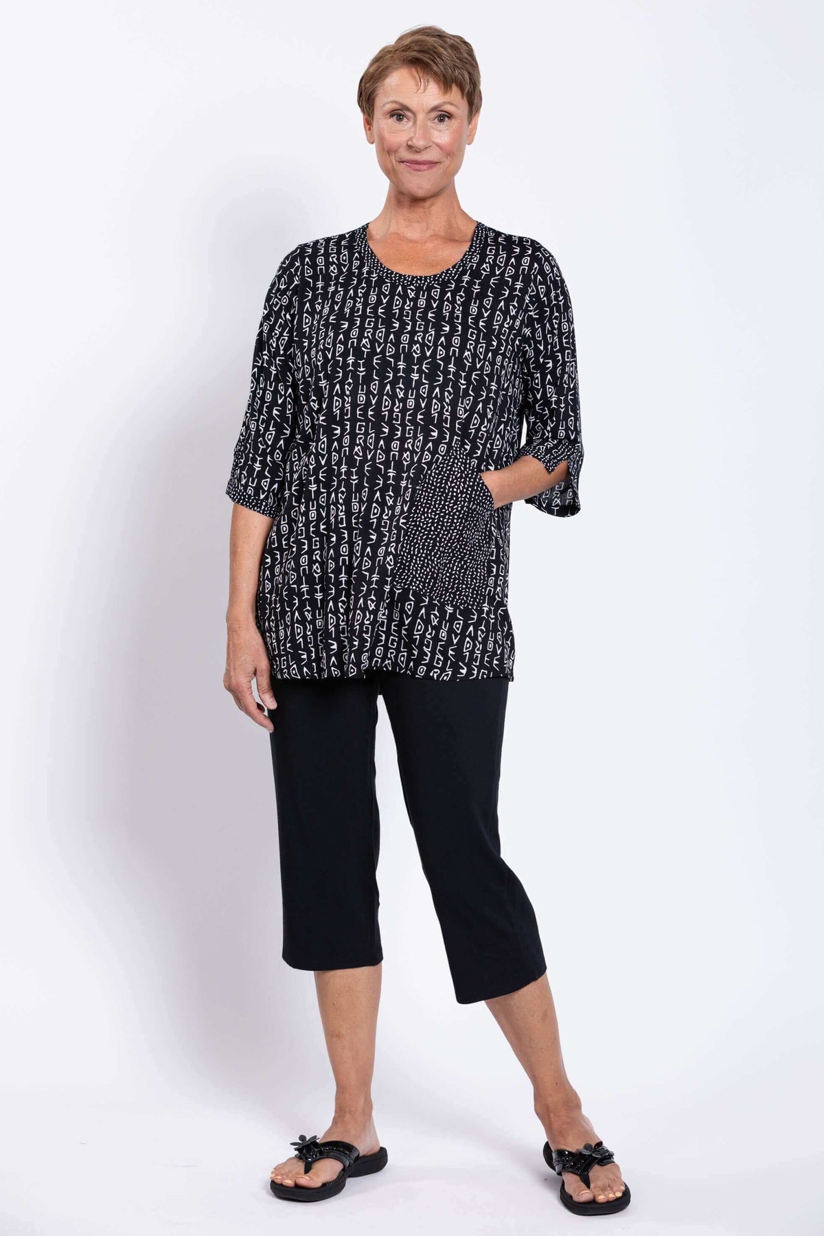 Model with hand in pocket, showcasing the Palace Blouse's patterned pocket detail