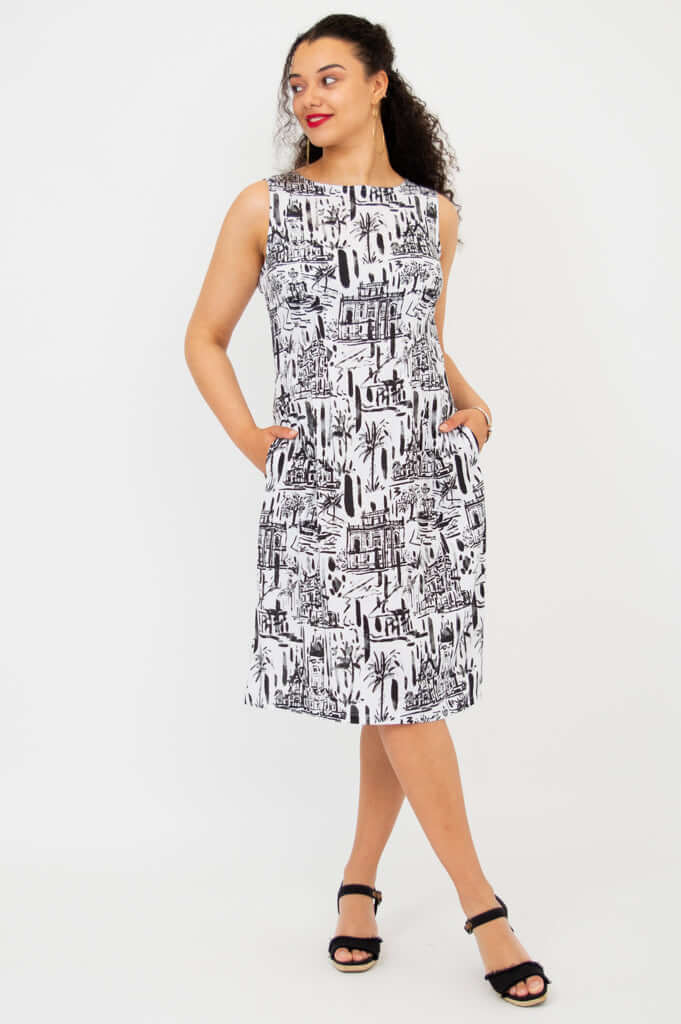 Three-quarter front view of Patricia shift dress with cityscape print
