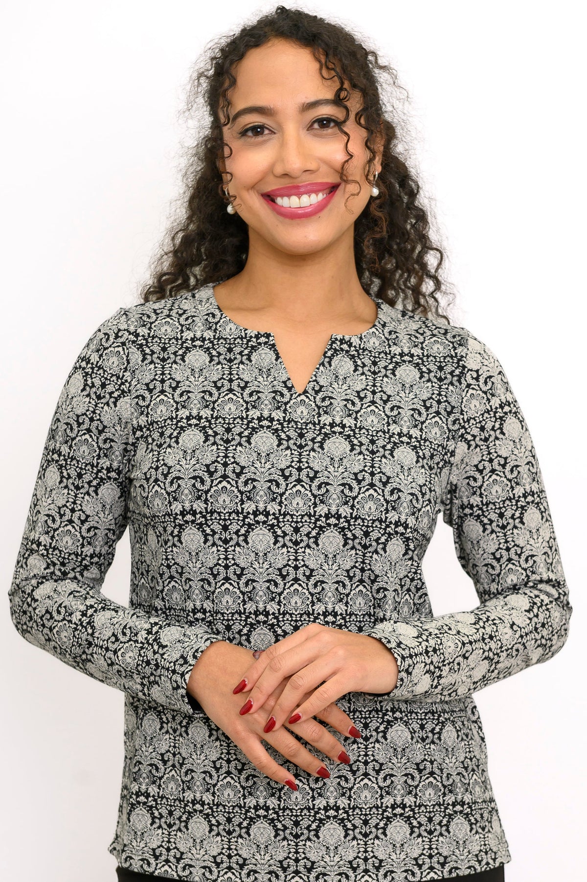 Close-up of a women's floral lace print bamboo long sleeve blouse featuring a notched sweetheart neckline.