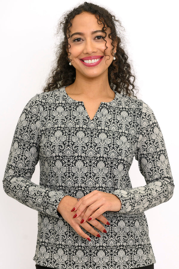 Close-up of a women's floral lace print bamboo long sleeve blouse featuring a notched sweetheart neckline.