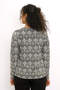 Rear view of a straight-cut bamboo cotton floral print blouse showing a clean draped back.