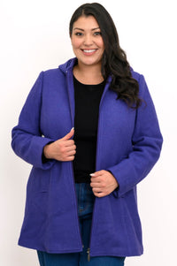 Woman wearing hip-length purple zippered coat with hood and black pants on a white background, front view