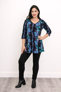 Smiling model in a teal floral patterned bamboo top, showcasing a relaxed fit and flared A-line silhouette.