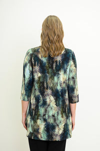 Rear view of a patterned long-sleeve knit top on a model, highlighting the flattering hip-covering length.
