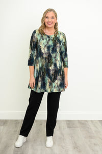 Flowy forest print bamboo-cotton tunic with a high round neck and 3/4 sleeves, styled with black pants and sneakers.