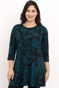 Women's longline pullover shirt in a dark teal leaf print with 3/4 sleeves, styled on a white backdrop.