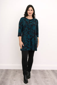 Model posing in a teal leaf pattern bamboo tunic, highlighting the flattering hip-covering length.