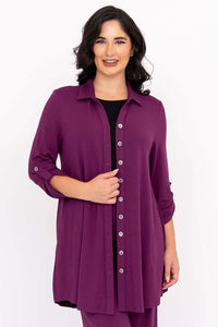 Front view of a second model in a plus size plum bamboo French terry tunic blouse