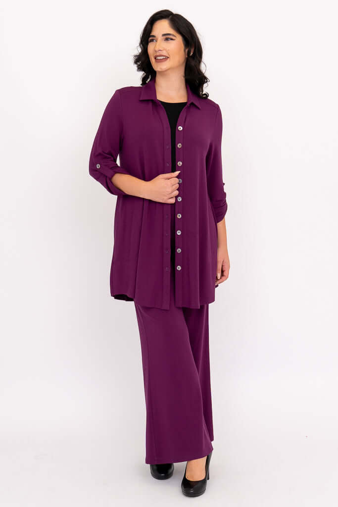 Full length of plus model in plum bamboo tunic and pants set with heels