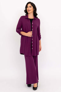 Full length of plus model in plum bamboo tunic and pants set with heels