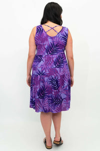Back view of purple tiered dress featuring criss-cross strap detail