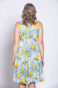 Model wearing Arden dress with tie-back detail, back view