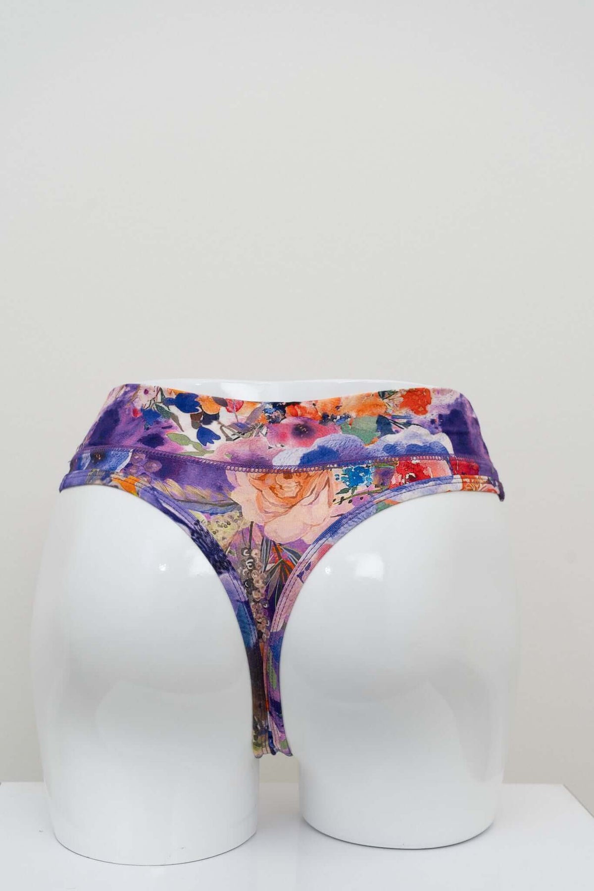 Rear view of floral bamboo high rise thong displayed on a mannequin