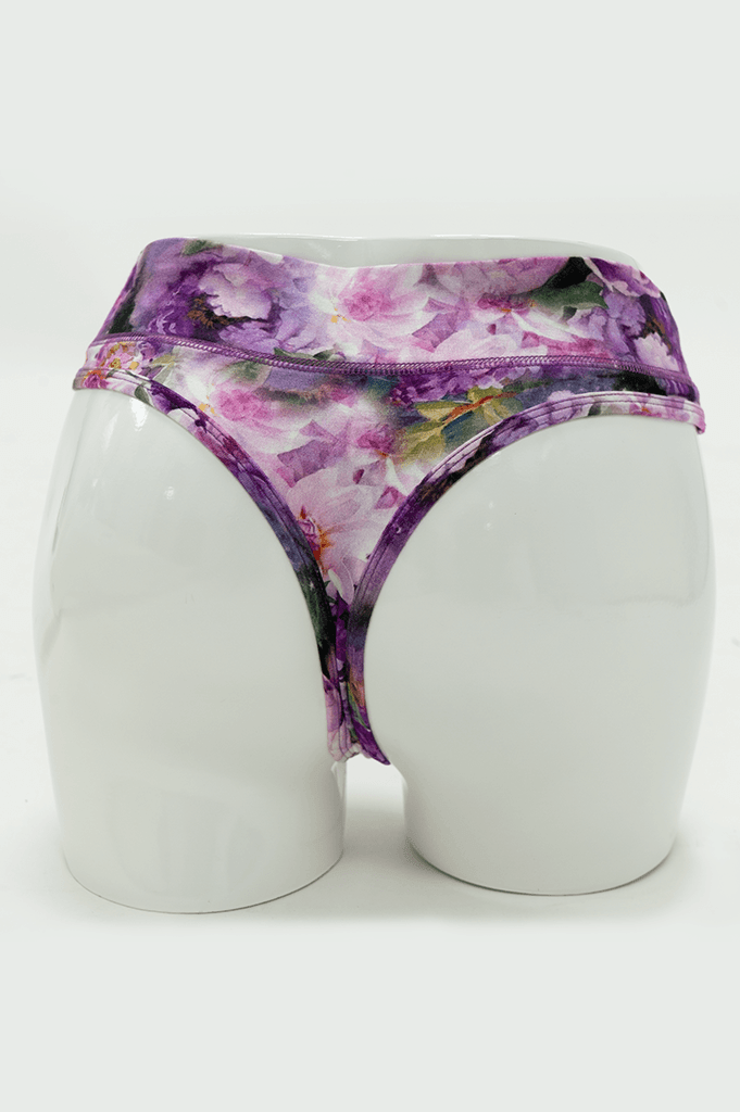 Rear view of purple floral bamboo thong underwear on mannequin