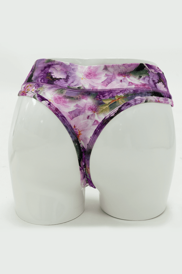Rear view of purple floral bamboo thong underwear on mannequin
