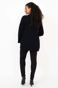 Back view of model in black Dallas Cardigan, showing relaxed fit