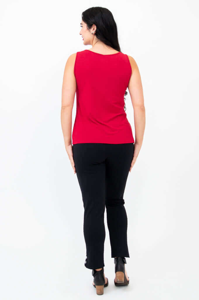 Back view of woman showcasing the fit of a red tank top with black pants