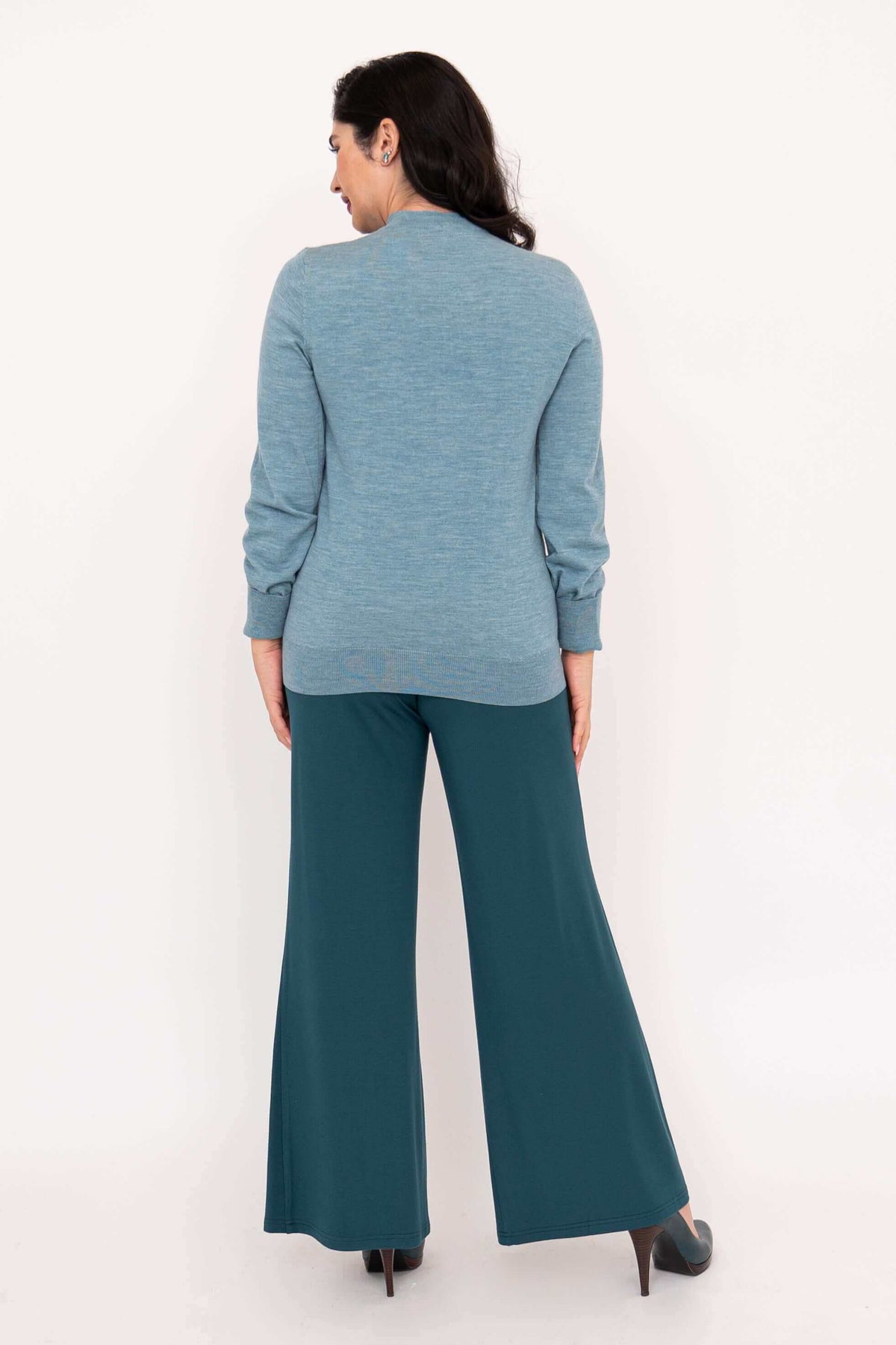 Rear view of woman in blue Kitten Cardigan and teal wide-leg pants