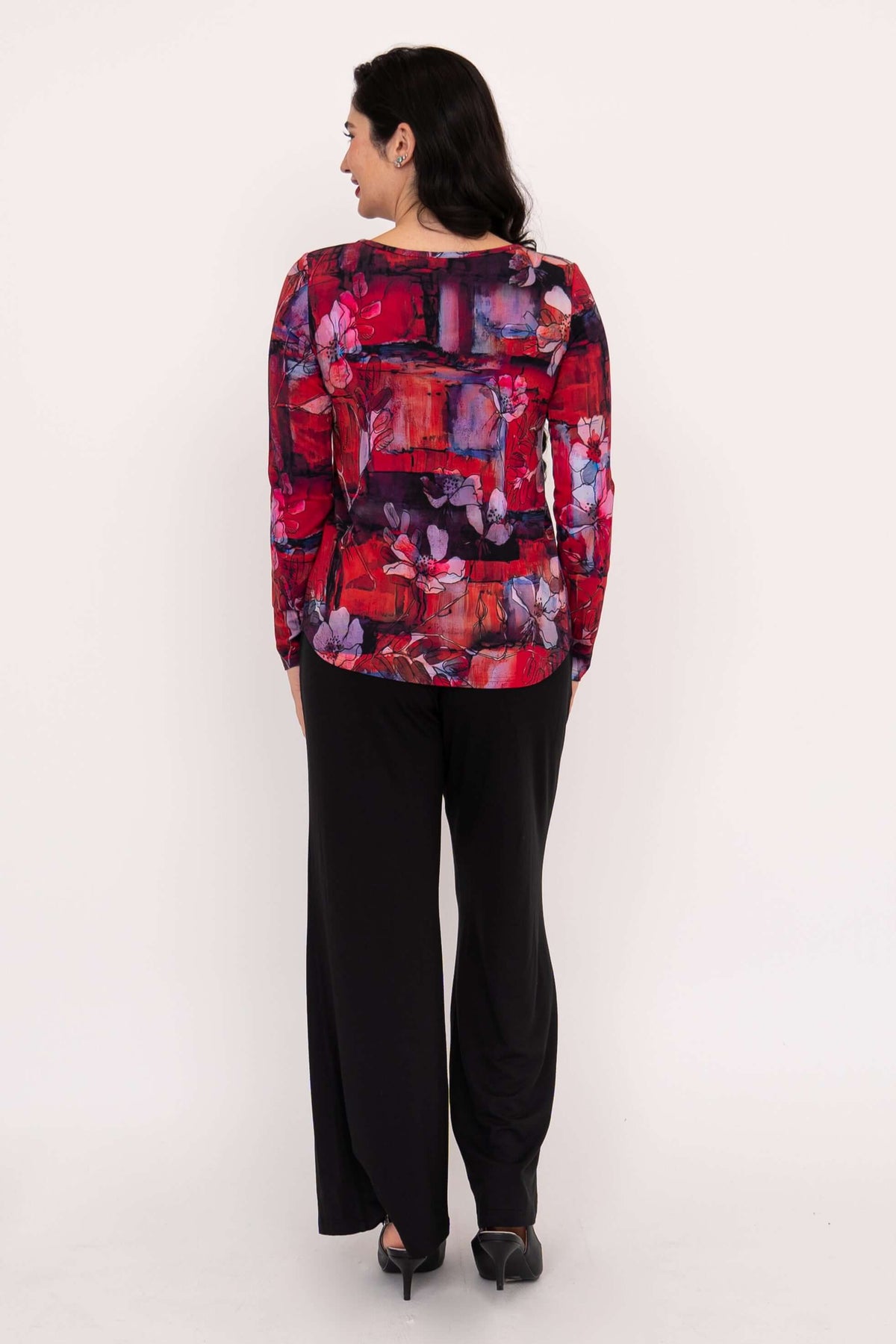 Back view of woman wearing red floral sweetheart neckline long sleeve top